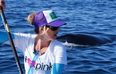 Pro Surfer Jodie Nelson gets whale escort